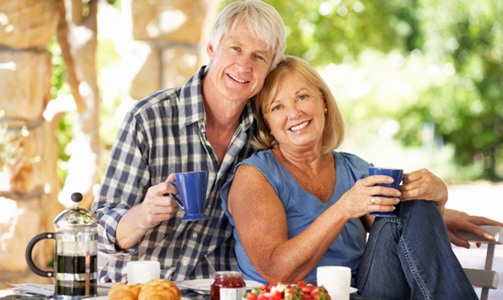 Couple enjoying a meal with the help of All on 4 dental implants