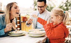 Family of three eating dinner