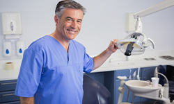 dental team member smiling in treatment room