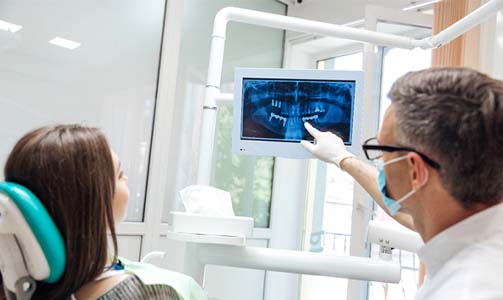 dentist showing a patient their x rays