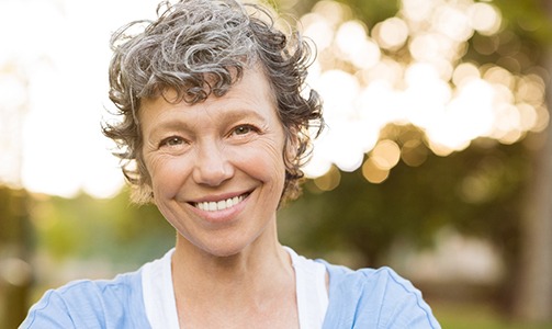 woman smiling after getting dental implants in Idaho Falls