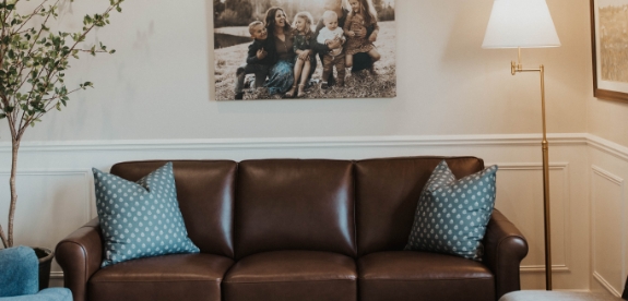 Two black and white plaid armchairs in waiting area of Idaho Falls dental office