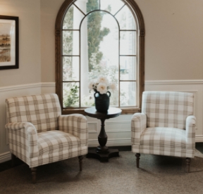 Brown leather loveseat in dental office waiting area