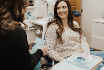 Man smiling and leaning back in dental chair