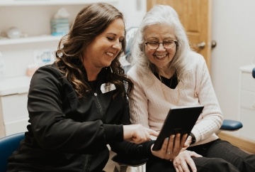 Smiling senior woman in dental chair