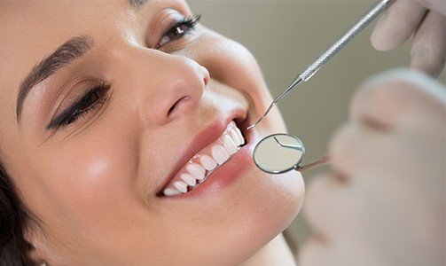 Woman receiving dental checkup