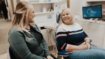 Smiling older woman in dental chair