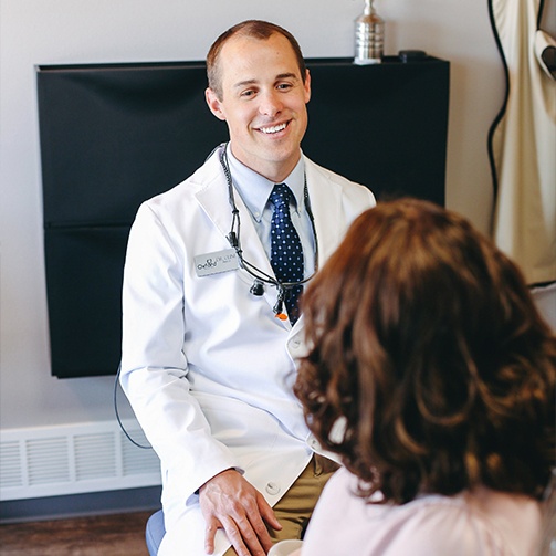 Doctor Cline smiling at patient during appointment for tooth colored fillings in Idaho Falls