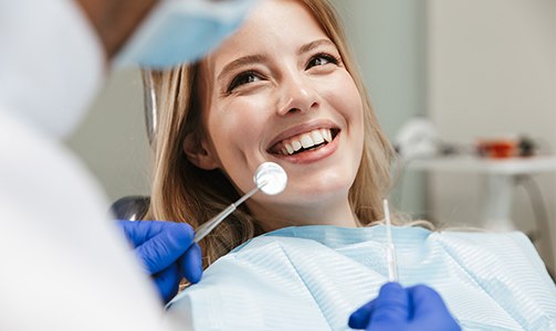 Woman in dental chair smiling